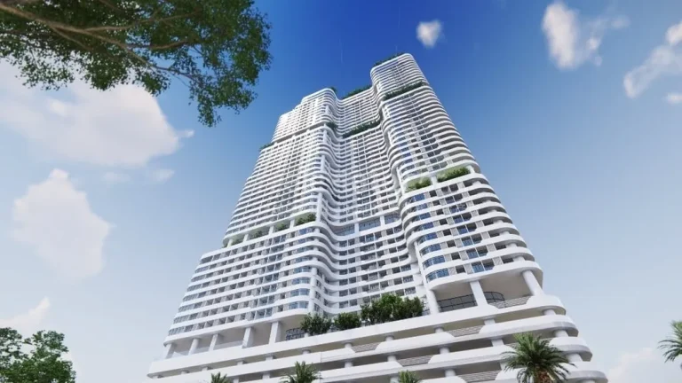 Modern high-rise building with a unique architectural design featuring multiple balconies and greenery integrated into the structure.