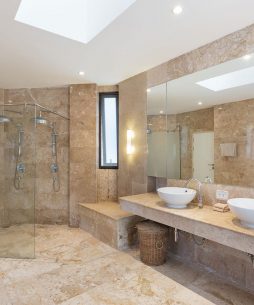 double sink and shower in marble bathroom